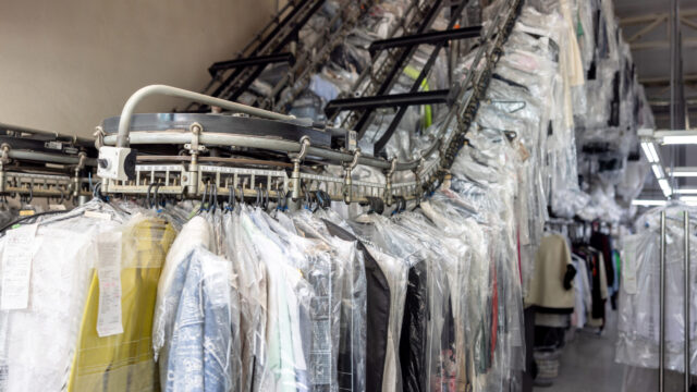 Clothes hanging on the conveyor belt at an industrial laundry